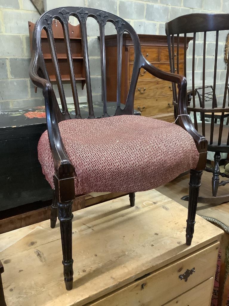 A Hepplewhite style carved mahogany open armchair, width 55cm depth 50cm height 92cm